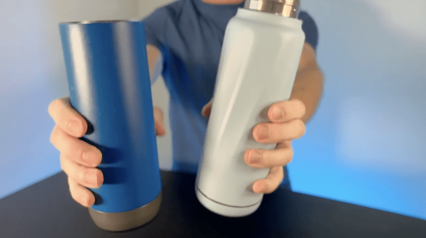 A 1 liter smart water bottle glowing on a counter to help track daily water intake.