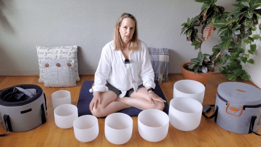 A person gently striking a beautiful singing bowl, illustrating how to choose a singing bowl that resonates with them.