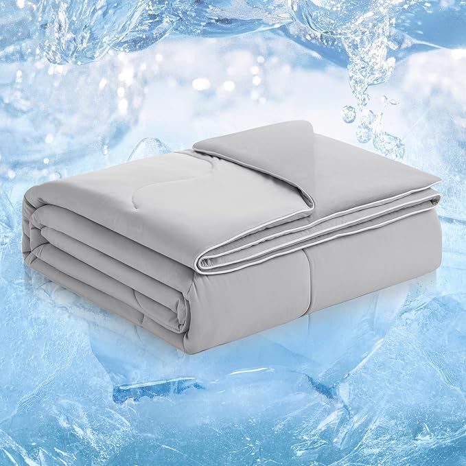 A folded grey weighted blanket for anxiety resting on a bed, showcasing its quilted texture for even pressure distribution.
