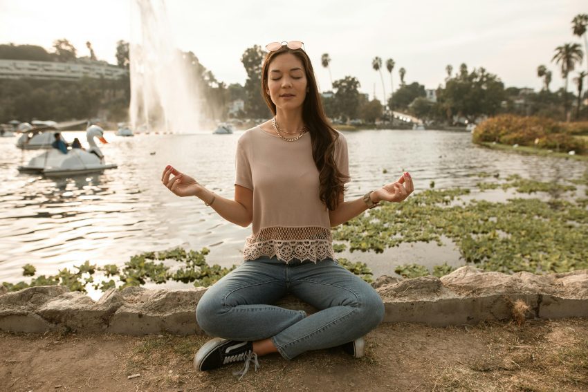 A person demonstrating proper diaphragmatic breathing technique, focusing on belly expansion.
